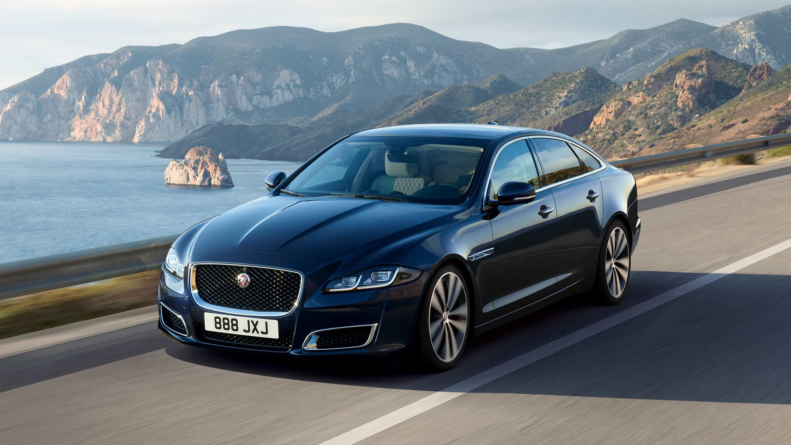 Jaguar XJ running on the driveway 