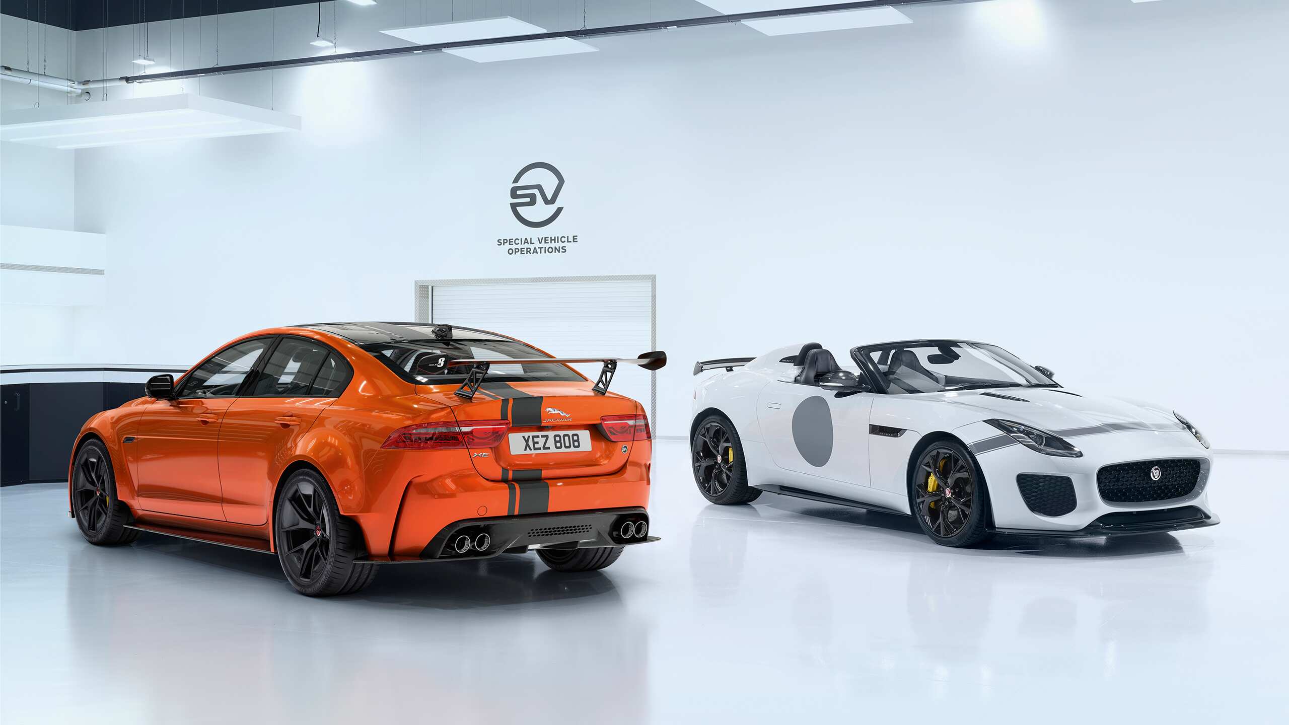 Two Jaguar Car Parked in Showroom